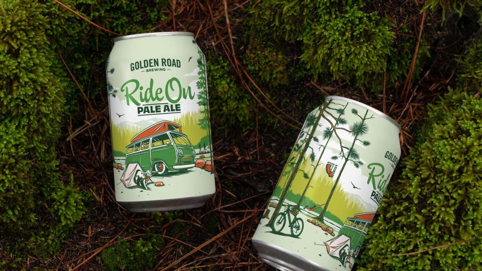 Two Golden Road beer cans sit in a beautiful forest bed of moss and pine needles. The cans are light green with a charming illustration of a vintage green van parked on the shore of a lake in the forest, camping. A cute dog is seen coming out of its own small “pup-tent” in the foreground, carrying a stick. The beer name is Ride On Pale Ale, which is seen in playful kelly green script and dark green block letters.